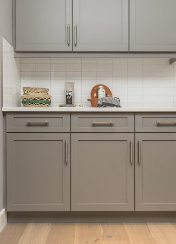 A beautiful shot of a modern house kitchen shelves and drawers